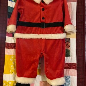Santa Clauses plush one piece suit.